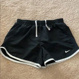 Black Nike shorts with white rim. Girls